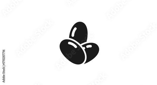 Three Dark Silhouettes of Oval Shaped Food Items.