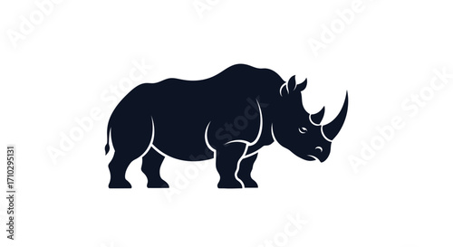 Silhouette of a Powerful Rhinoceros Standing Tall on White Background.