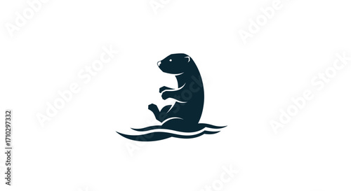 Dark silhouette of a playful otter sitting in the water, looking up.