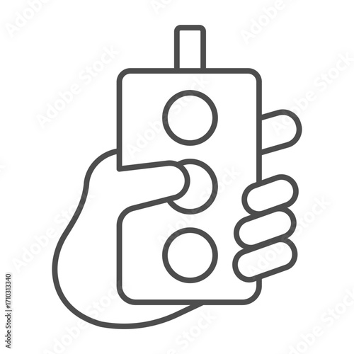 Wired remote with buttons in hand thin line icon, manufacturing concept, factory control process sign on white background, outline style icon for mobile and web design. Vector graphics.