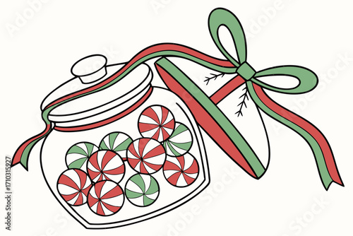 Christmas jar filled with red and green striped candies tied with a festive ribbon