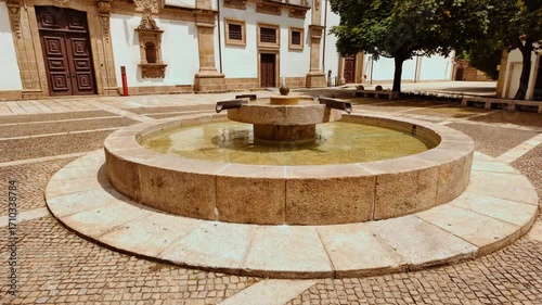 Santa Clara Convent houses Guimaraes City Hall within its lengthy granite wings cloistered courtyards and baroque church overlooking gardens in Portugal