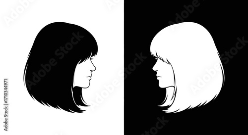 Two identical female profiles in black and white face each other, symbolizing duality and contrast.