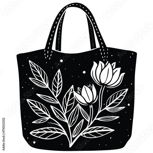 A chic black and white shopping bag adorned with a floral design is a stylish fashion accessory