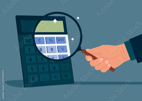 Hand holding a magnifying glass analyzing calculator. Concept of financial management, optimization, duty, financial accounting. Aspiration to win and success in business.