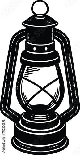 An ancient retro kerosene oil lamp with a metal body and a glass chimney illuminates a dark room