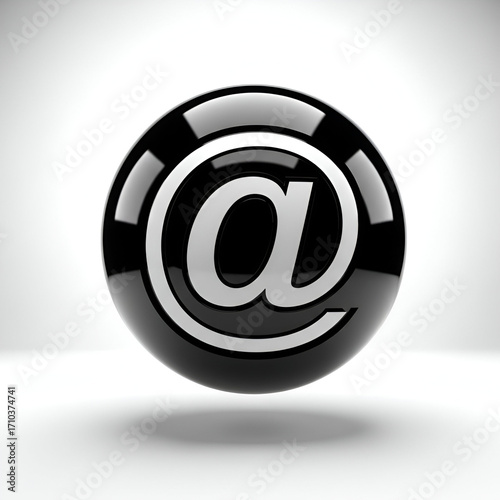 Glossy black sphere with a silver at symbol, representing email or online communication