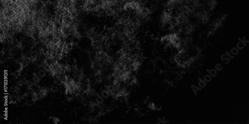 Black with dark gray texture background. Freeze motion of white particles. Black with dark gray texture background. black concrete wall background. Dark cement wall in retro concept.
