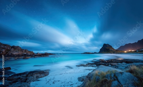 Photograph of the beach in lofoten, norway at night with a beautiful aurora, long exposure