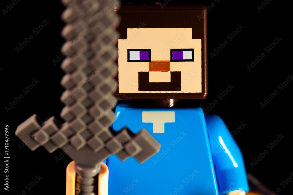 Obraz premium LEGO Minecraft Steve face closeup with a sword on a black background