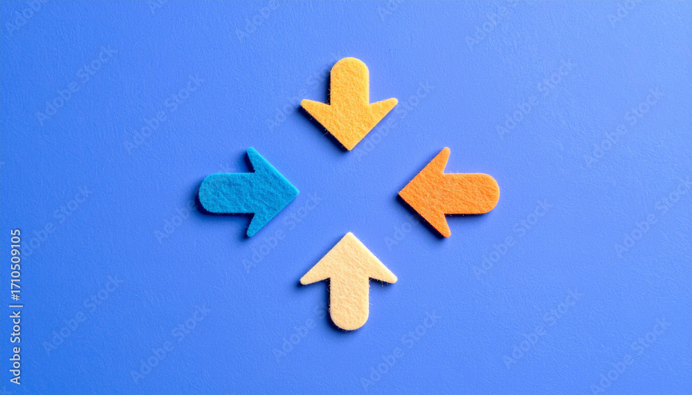 Obraz premium カラフルなフェルト素材の矢印が並ぶシンプルな構図。方向や選択、ビジネスやアイコンに使える抽象イメージ。