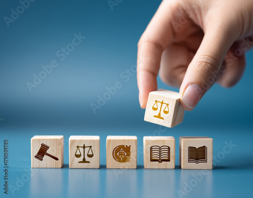 Wallpaper Mural wooden block with icons of law, justice, and brain on a table surface Torontodigital.ca