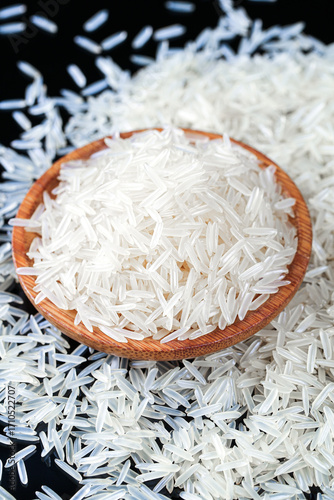 White Long Grain Rice in Wooden Bowl - Fragrant Basmati Jasmine Rice Grains