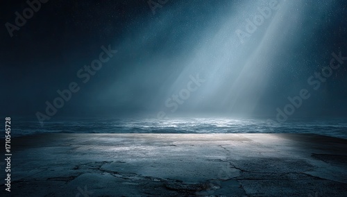 Dramatic atmospheric light rays illuminating a textured dark surface.