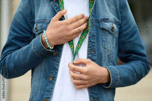 Sunflower lanyard, symbol of people with invisible or hidden disabilities.