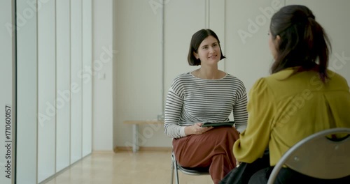 Business Interview with Digital tablet in Contemporary Office Setting