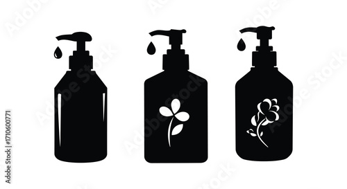 Black silhouette of three pump bottles with liquid droplets