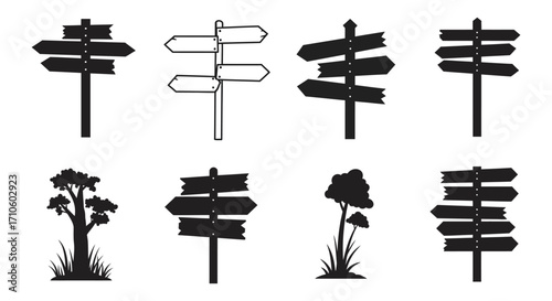 Collection of directional signposts trees and landscape silhouettes in black and white