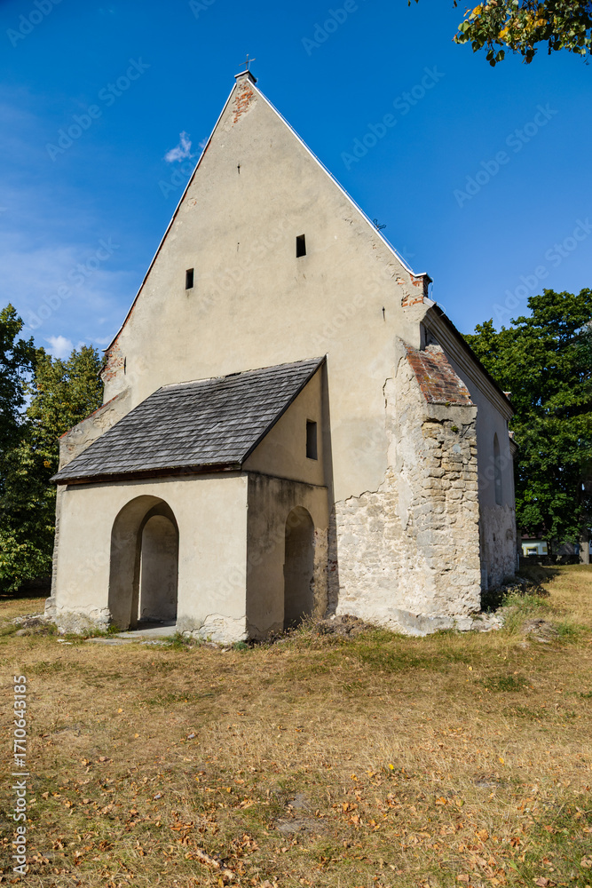 Fototapeta premium Medieval Catholic church dedicated to All Saints. Szydlow, Swietokrzyskie Province, Poland