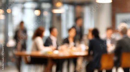 Unfocused Executive Meeting - Gentle blur effect of an executive meeting scene with people and office decor. High quality