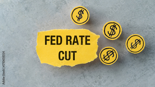 Fed Rate Cut on top of a downward falling graph, macro closeup view. Concept on FOMC adjusting rates to address inflation and the .