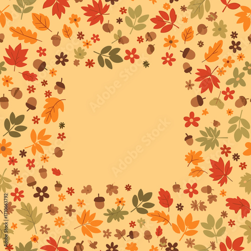 A festive arrangement of colorful autumn leaves and acorns encircling a blank space.