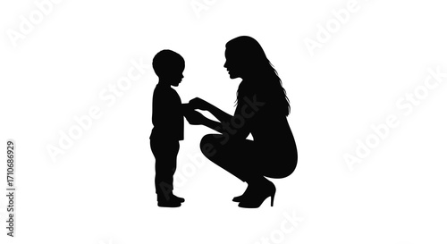 Silhouette of a mother crouching to connect with her young child