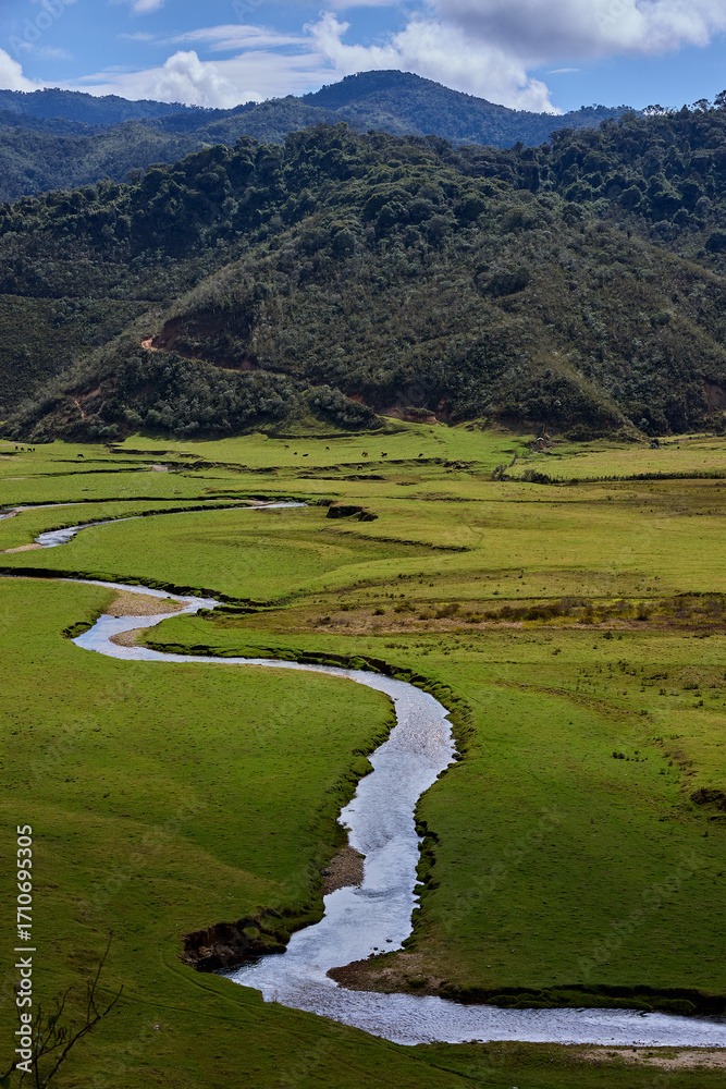 Obraz premium Vast and breathtaking, the Huaylla Belén Valley in Amazonas, Peru unfolds in gentle curves of grassland and water—where the Andes and sky meet in quiet harmony.