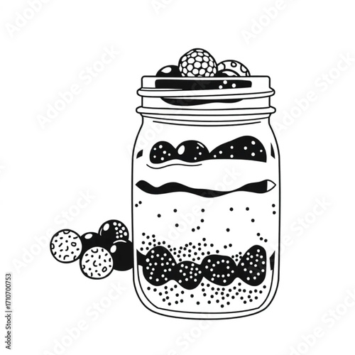 Chia seed pudding layered with berries in a mason jar