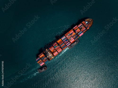 photograph of large container ship sailing on a deep sea, fully loaded with multi-colored containers, reflecting global maritime transport and logistics, cinematic dark tone  process.