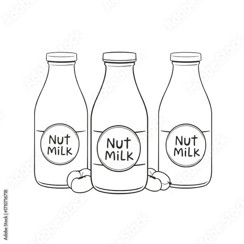 Homemade nut milk in glass bottles with labels