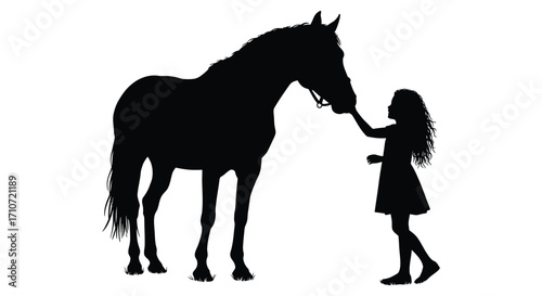 Silhouette of a girl gently reaching out to touch a majestic horse