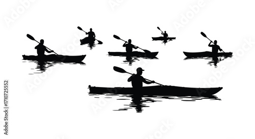 Silhouettes of kayakers paddling on calm water in a peaceful outdoor scene
