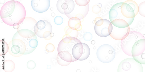 Soapy bright multicolored bubbles fly randomly on a white background. Beautiful circles colorful soap bubbles texture background. Design soap bubbles on a white background. Soap bubbles randomly flew.