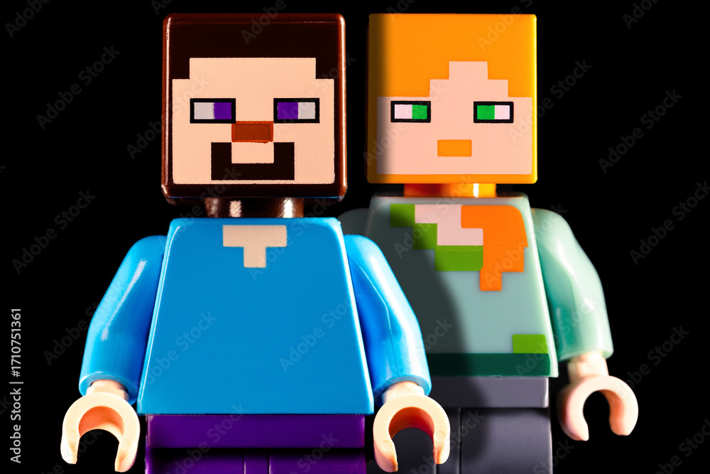 Obraz premium LEGO Minecraft Steve and Alex standing on the black background