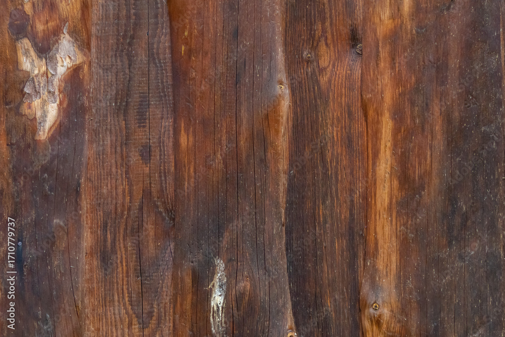 Naklejka premium Weathered Wooden Wall of a Rustic Country Barn – Vintage Rural Texture Background