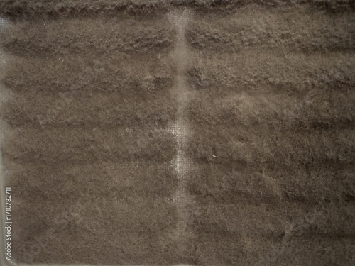 Foto Close-up of a dirty, clogged HVAC air filter full of dust, dander, and allergens