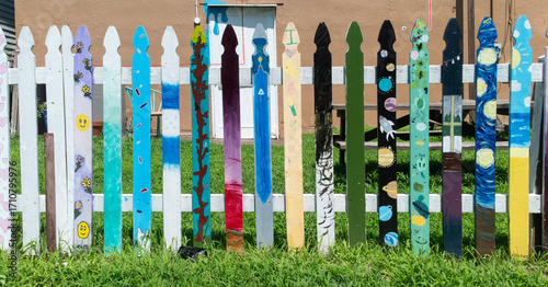 Fence pickets painted by children