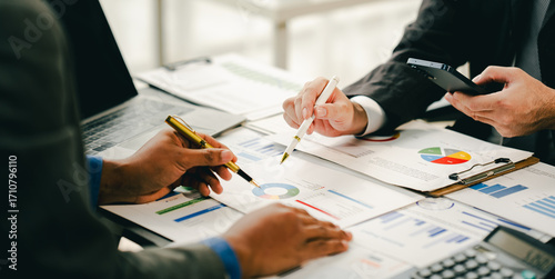 Young colleagues discuss business brainstorming and price charts analyze business people at the desk brilliantly in modern collaborative office teamwork ideas. Calculate personal tax for customers