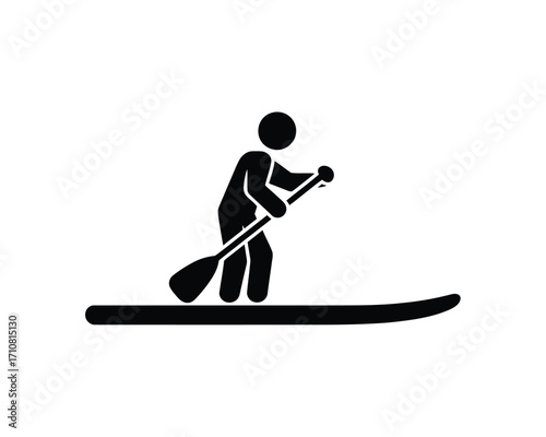 Silhouette of a person paddleboarding on a calm body of water