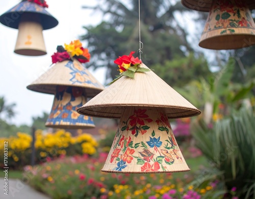 Colorful woven cone decorations hanging amidst flowers