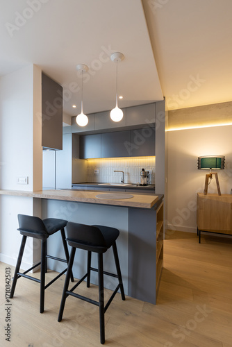 Kitchen interior with bar chairs and counter