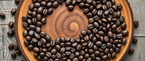Dark roasted coffee beans encircle a rustic circular wooden board,  top view,  natural