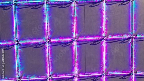 Futuristic Neon Grid Pattern with Vibrant Blue and Green Light Reflection Effects
