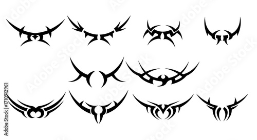 Tribal tattoo silhouettes set featuring bold symmetrical designs