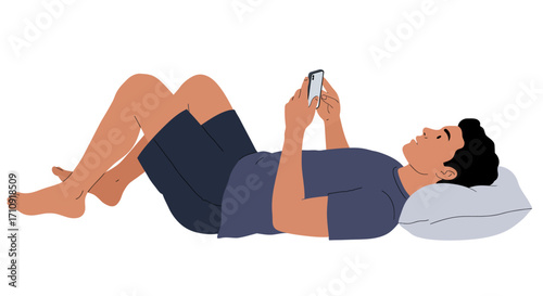 Relaxed man lying and using phone in casual attire