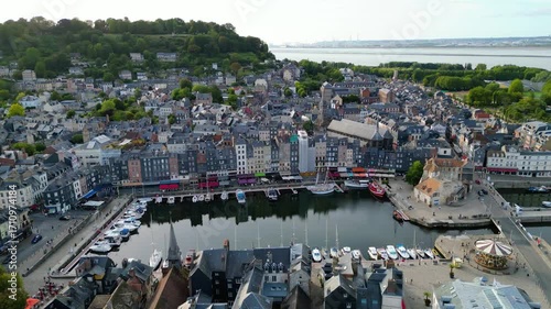 Aerial view of Honfleur, a charming small town in Normandy, France, with its picturesque harbor, historic buildings, and colorful houses, a popular destination for tourism, photography, and cultural 