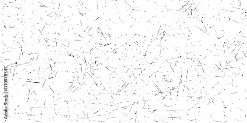 Gritty black and white paint splatters on a textured grunge wall create a vintage background