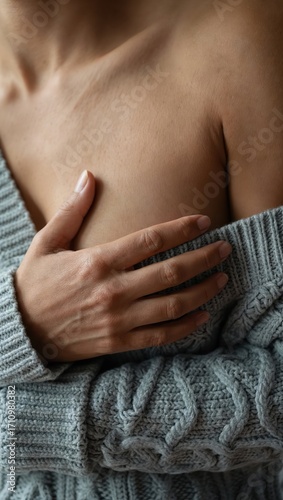 Woman pressing her chest symbolizing of breast cancer prevention and early detection awareness campaign.