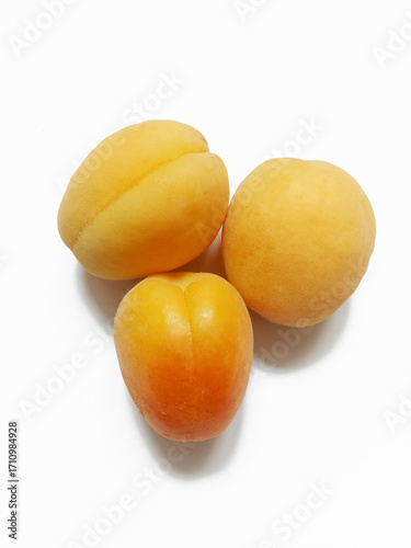 fresh apricots on the white background